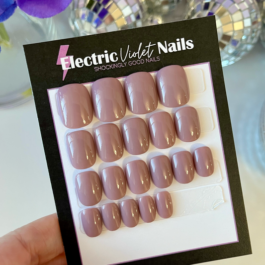 nude press-on nails on xtra xtra short squoval shape. hand painted