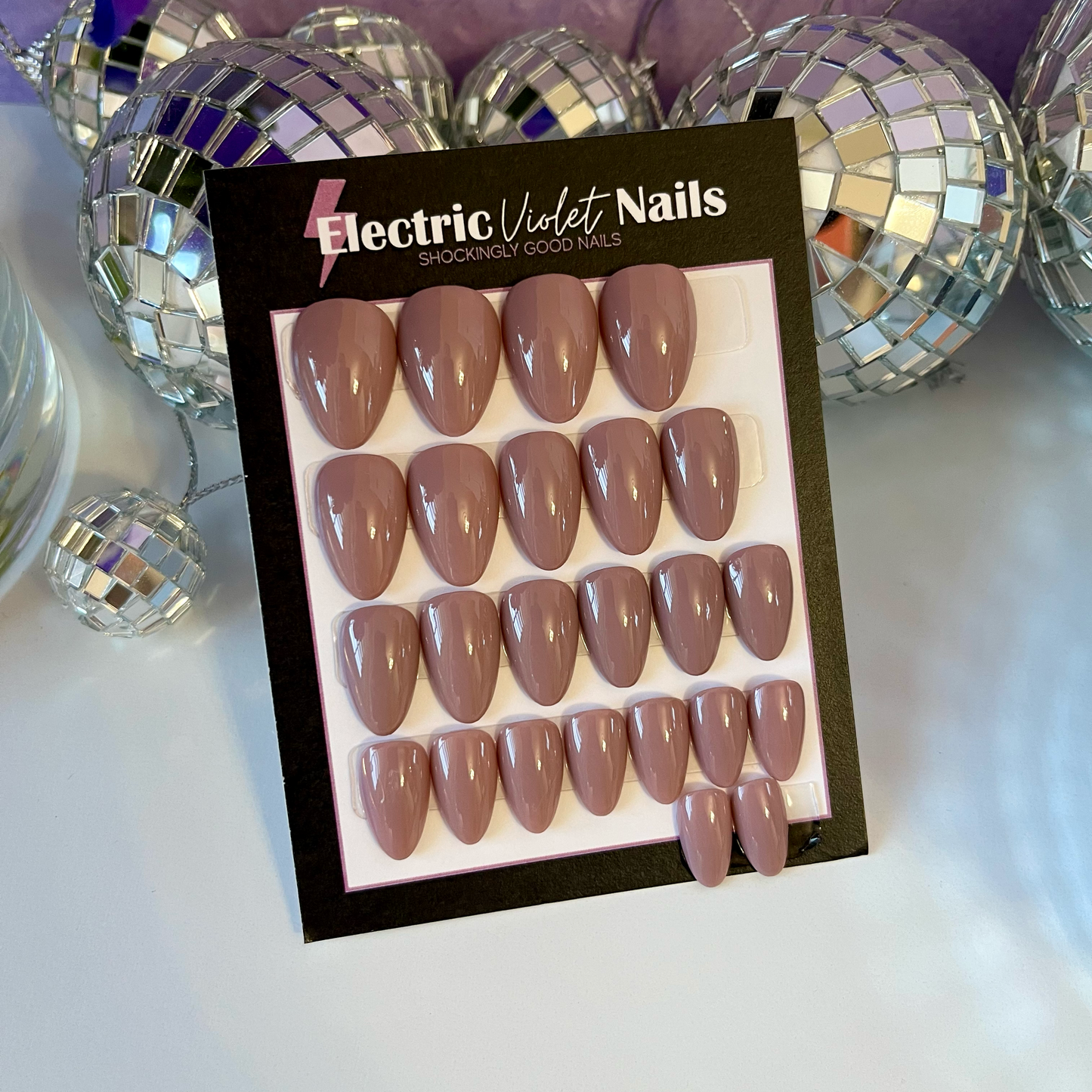 medium tone nude solid color press-on nail set on Xtra short almond shape