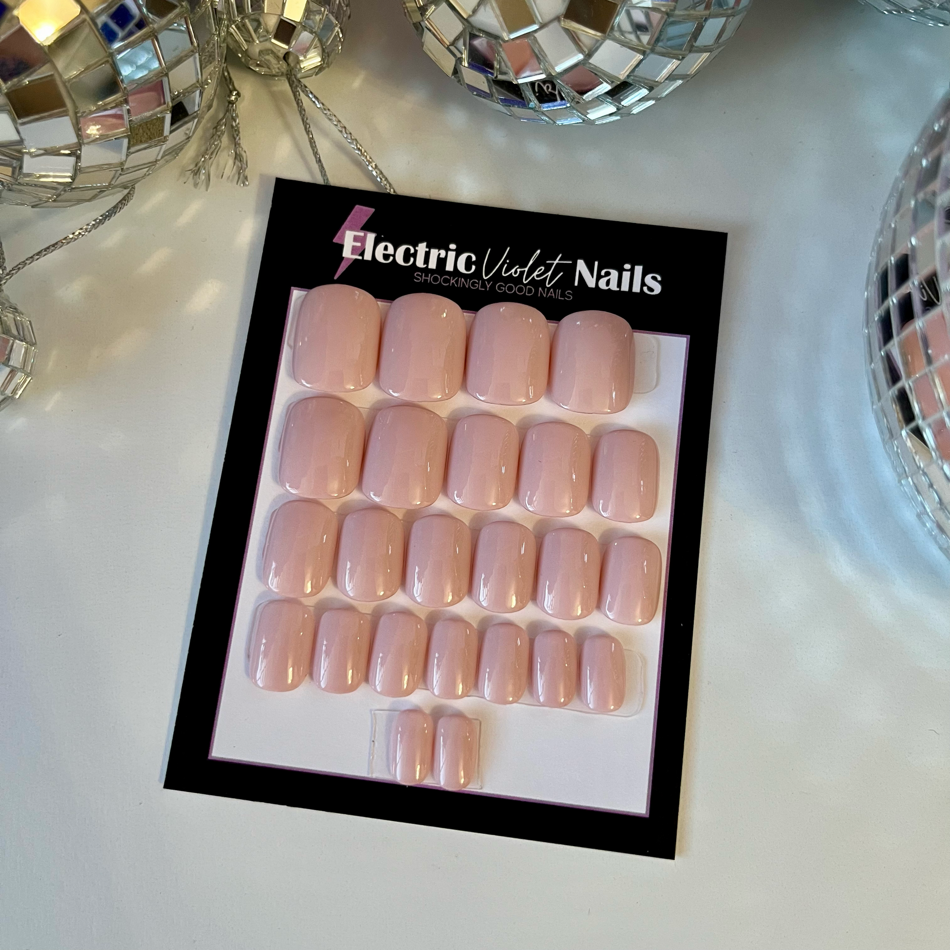 Solid color nude hand painted press-on nail set on xtra xtra short squoval
